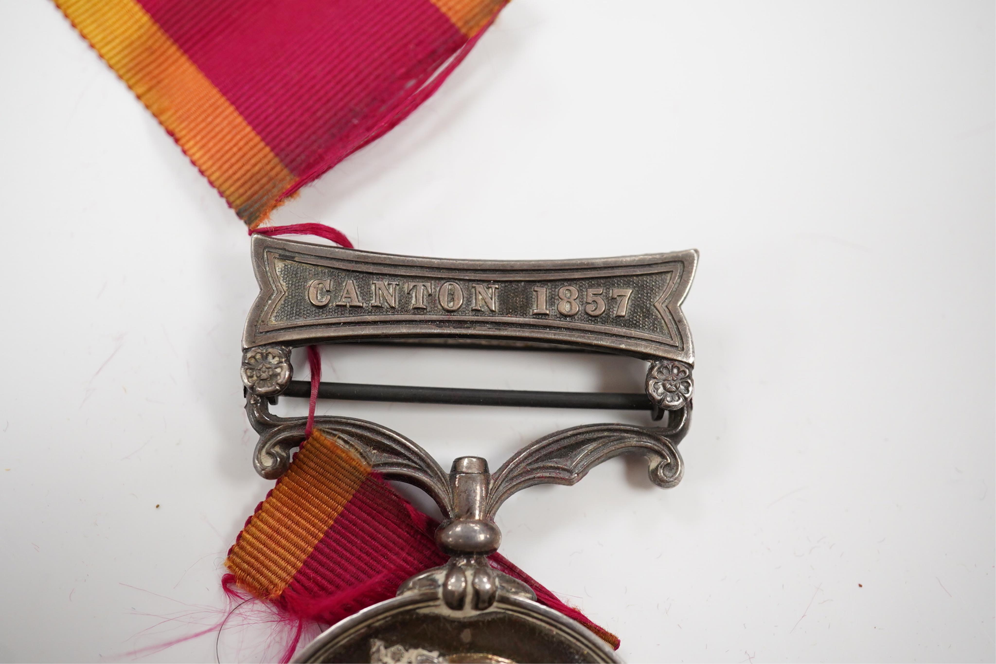 A Second China War Medal 1861 with Canton 1857 clasp, unnamed, navy issue.